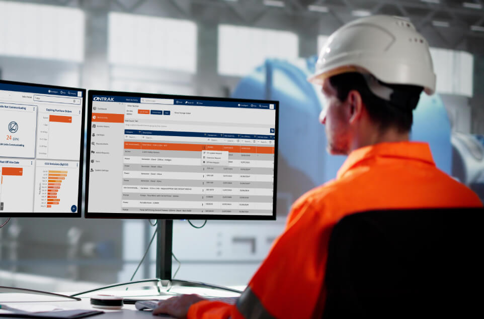 A construction worker using the Ontrak SaaS system to support their project A construction worker using the Ontrak SaaS system to support their project