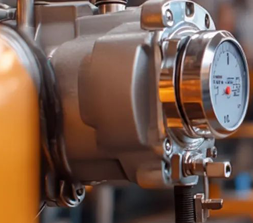 Close-up of a pressure gauge on an industrial portable air compressor