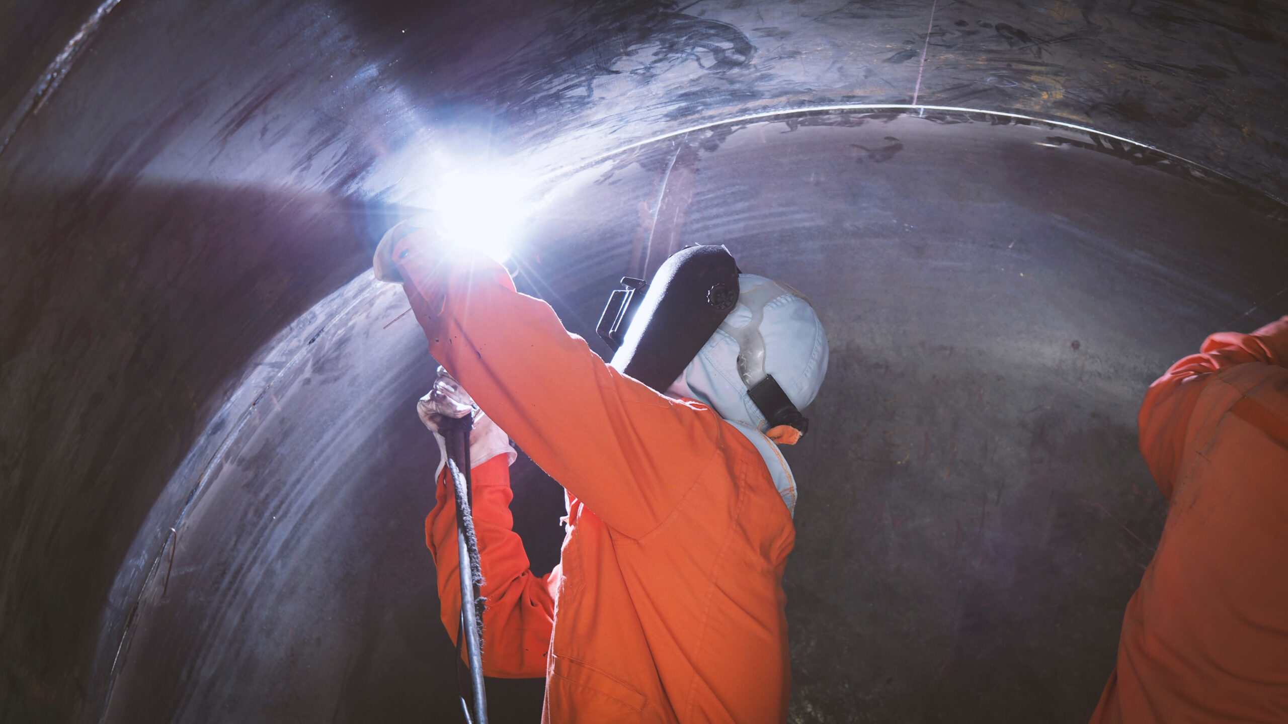 Welder using a dual welder compressor inside a storage tank.